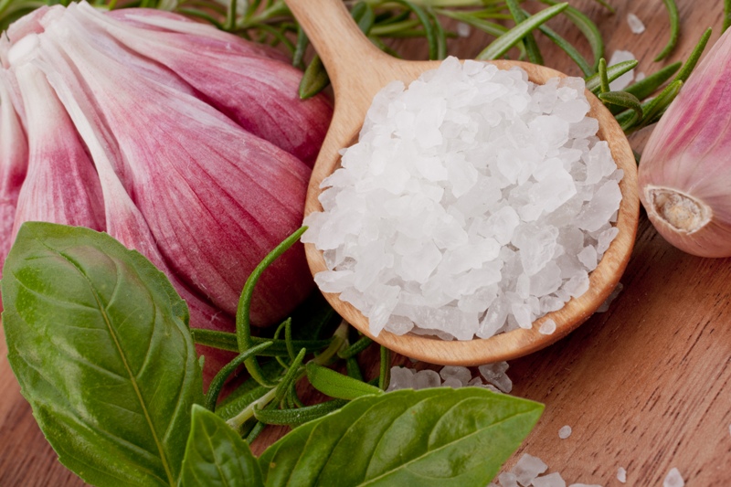 Fresh herbs and salt spoon